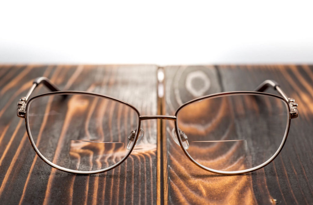 bifocal lenses sit on a table